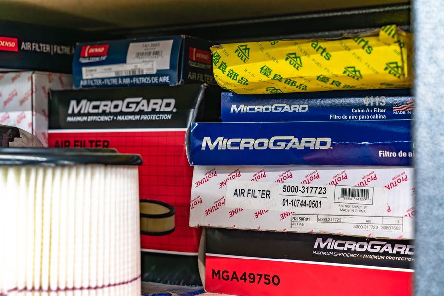 Boxed cabin and engine air filters on the parts shelf at Auto Analytx in Auburn, CA