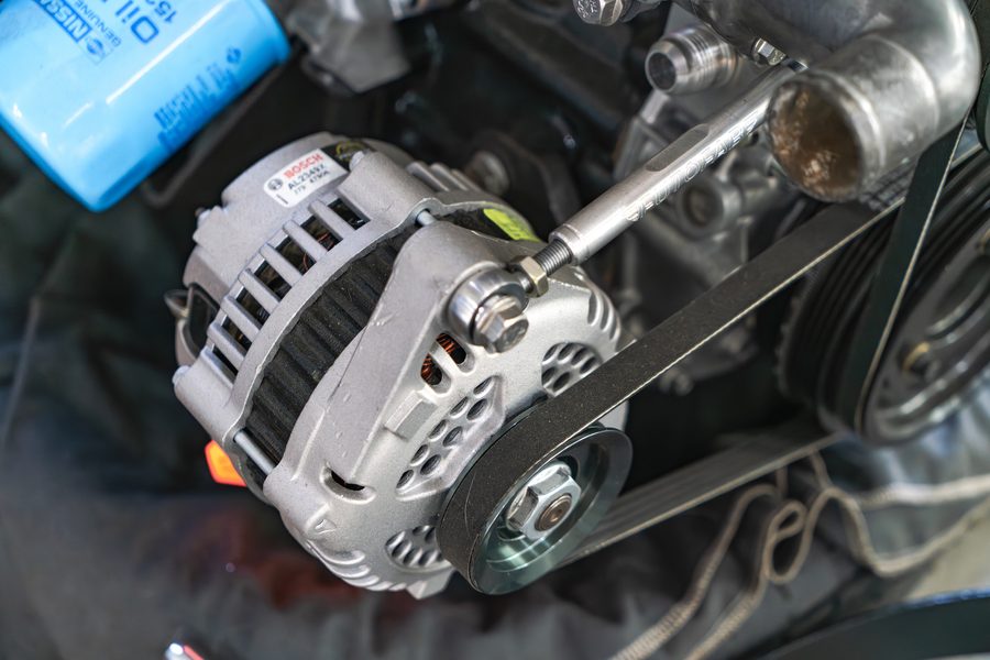 Newly installed alternator and drive belt on a rebuilt engine