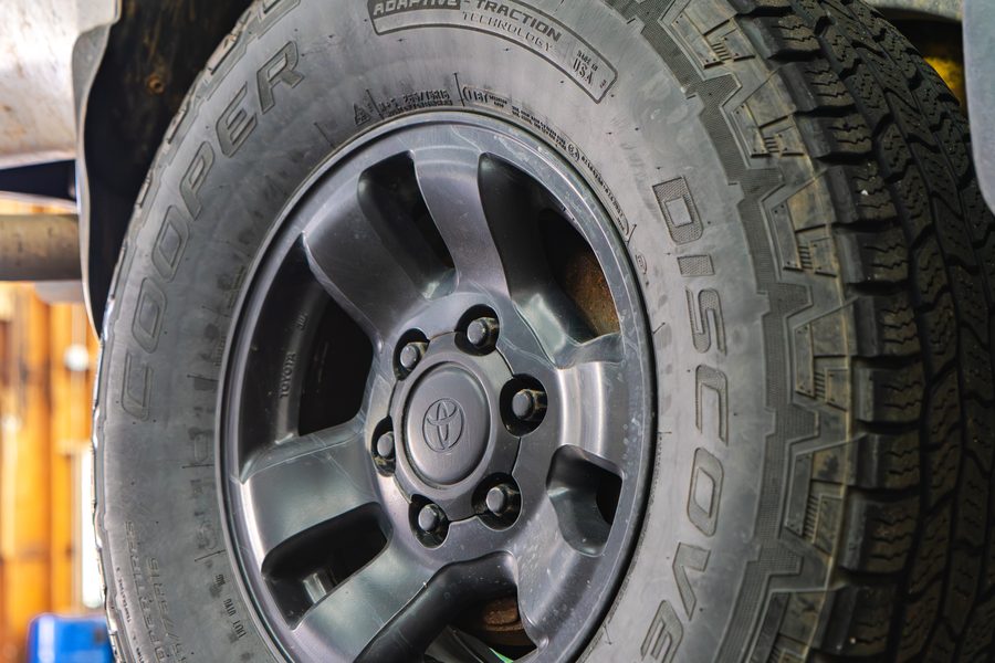 Cooper Discoverer AT3 all-terrain tire mounted on a Toyota alloy wheel