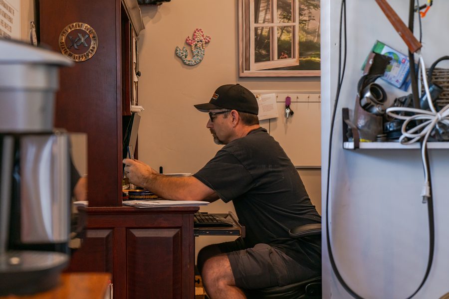 Auto Analytx owner working at the office desk in Auburn, CA