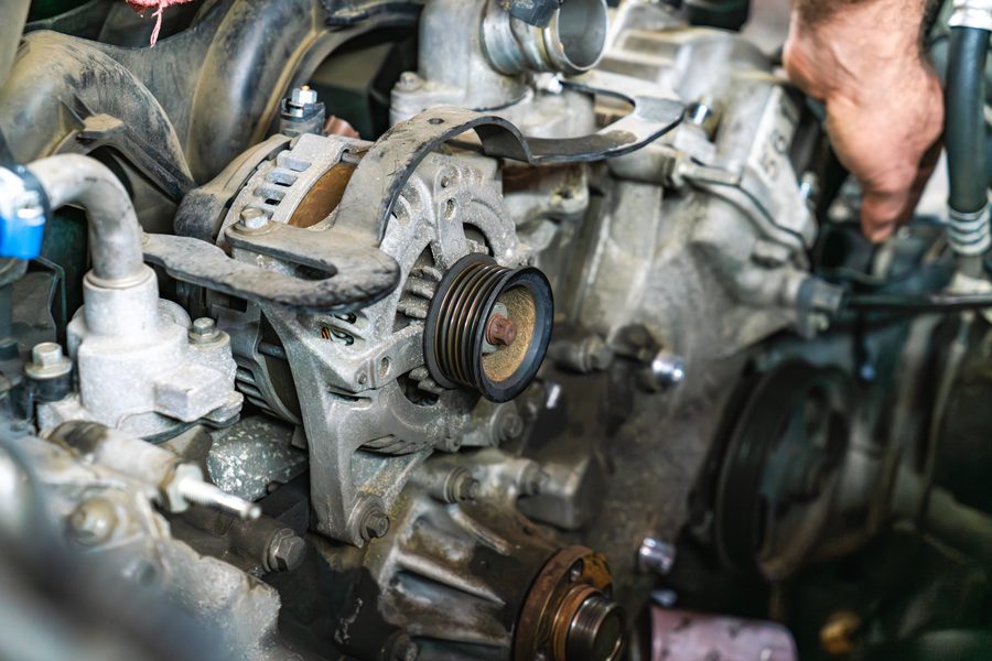 Alternator and serpentine belt on an engine during service