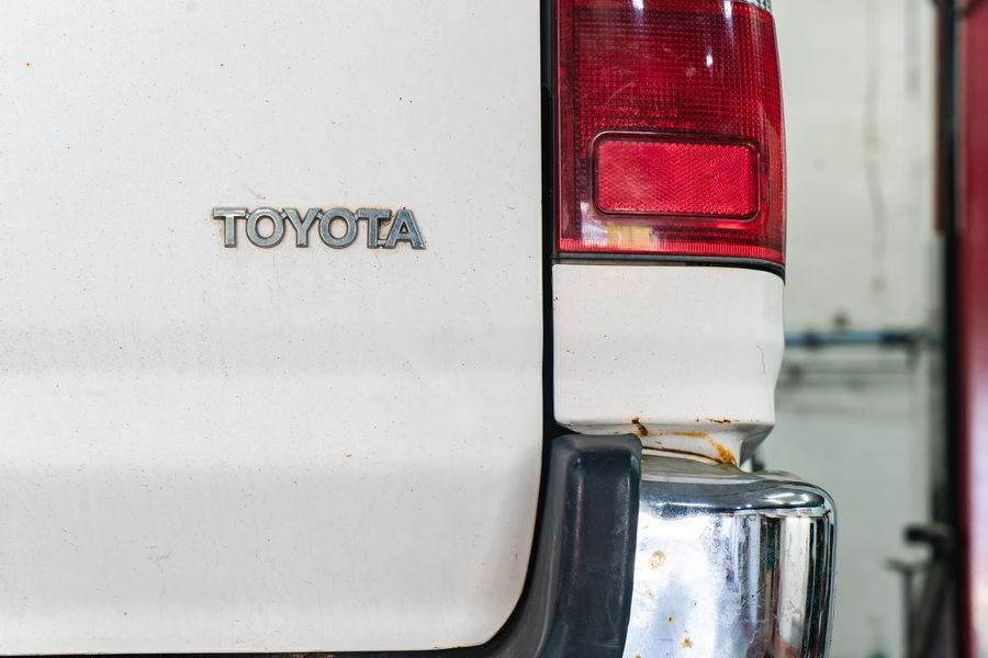 Toyota badge on the tailgate of a truck in for service at Auto Analytx